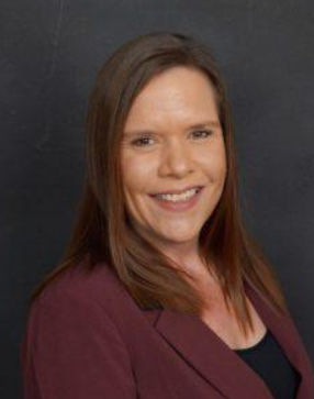 A woman smiling for the camera.