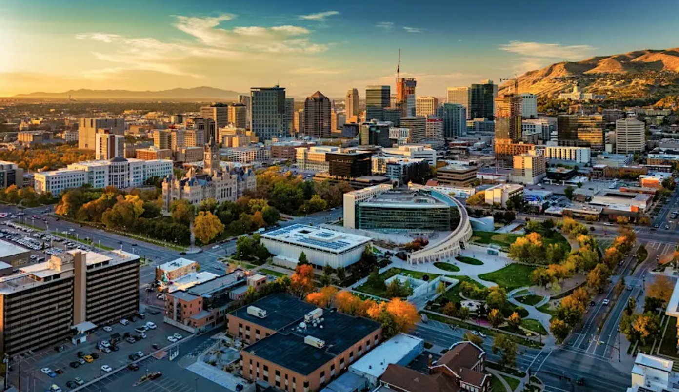 A city with a large park and a large circular building.