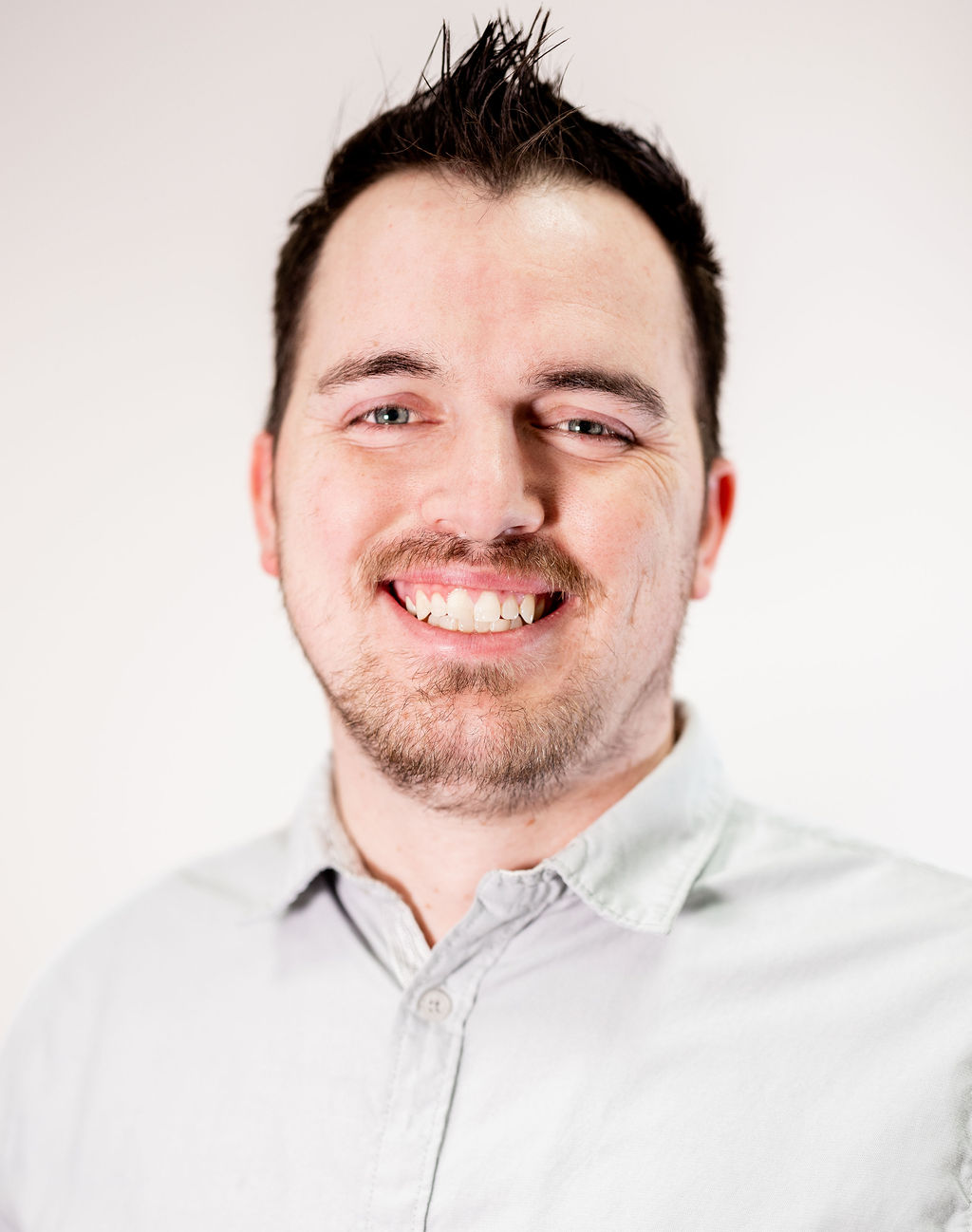 A man smiling for the camera.