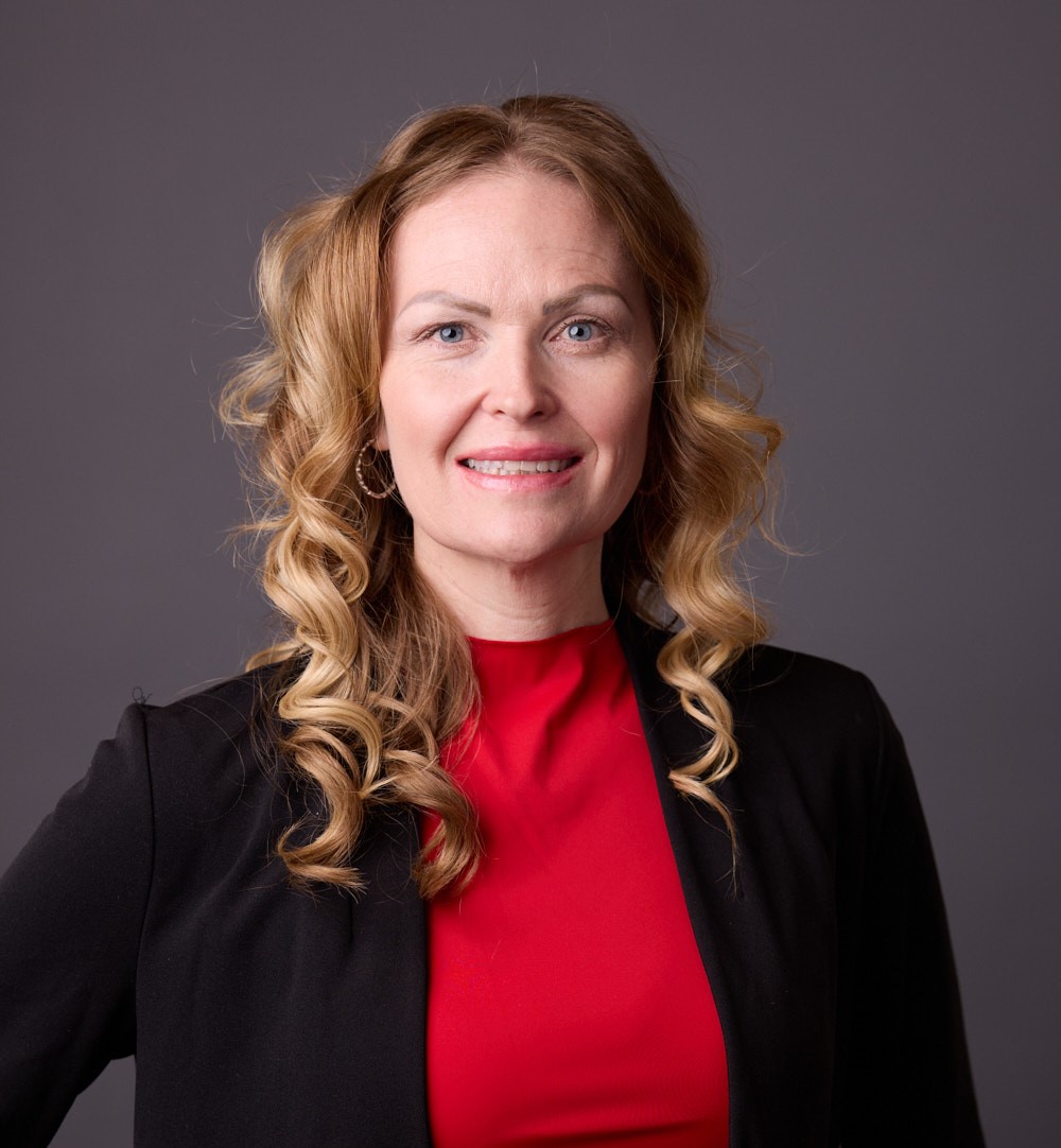 A person in a black suit.