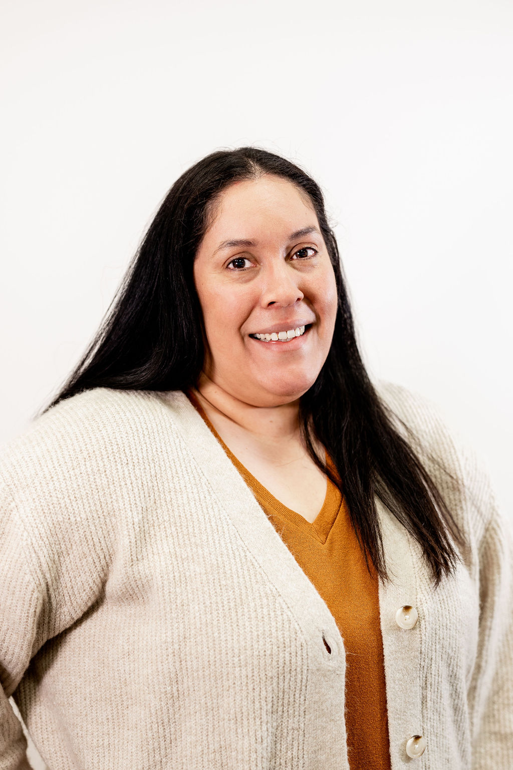 A woman smiling for the camera.