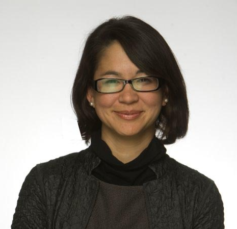 A woman wearing glasses.