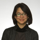 A woman wearing glasses.