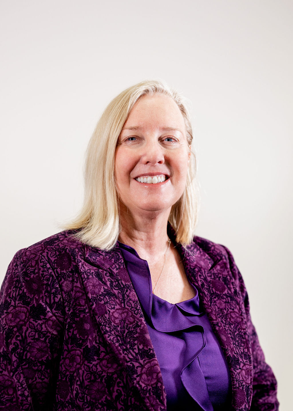 A woman smiling for the camera.