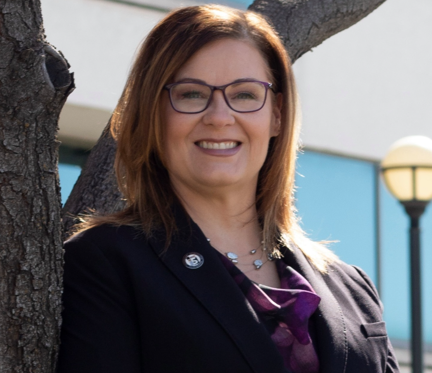 A woman wearing glasses.