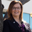 A woman wearing glasses.