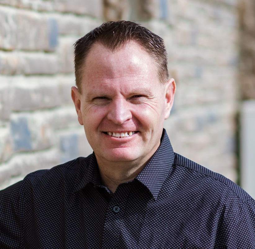 A man smiling for the camera.