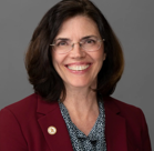 A woman wearing glasses.