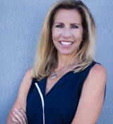 A woman with her arms crossed.