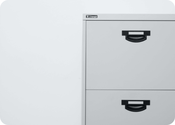 A white rectangular object with a black handle.