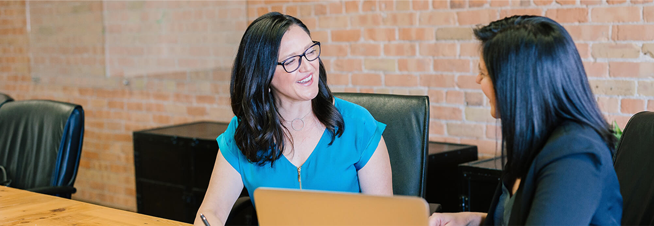 A woman sitting at a desk.