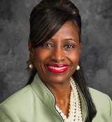 A woman smiling for the camera.