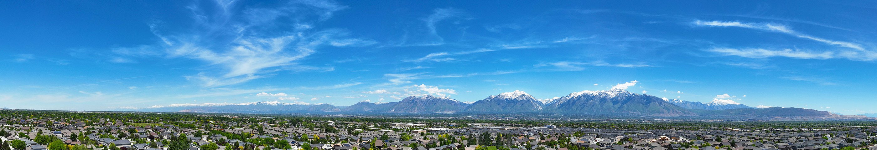 A city with mountains in the background.