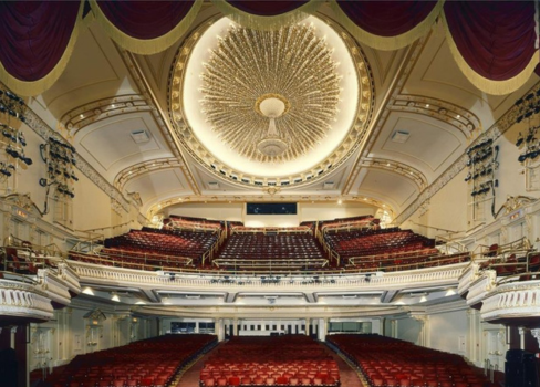 A large theater with a large chandelier.