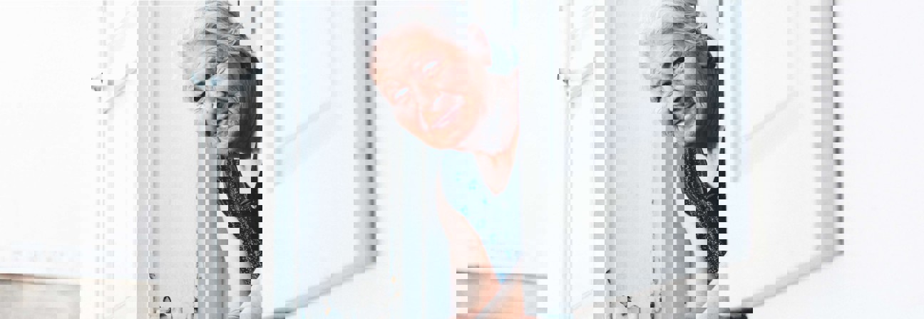 A man leaning against a door.