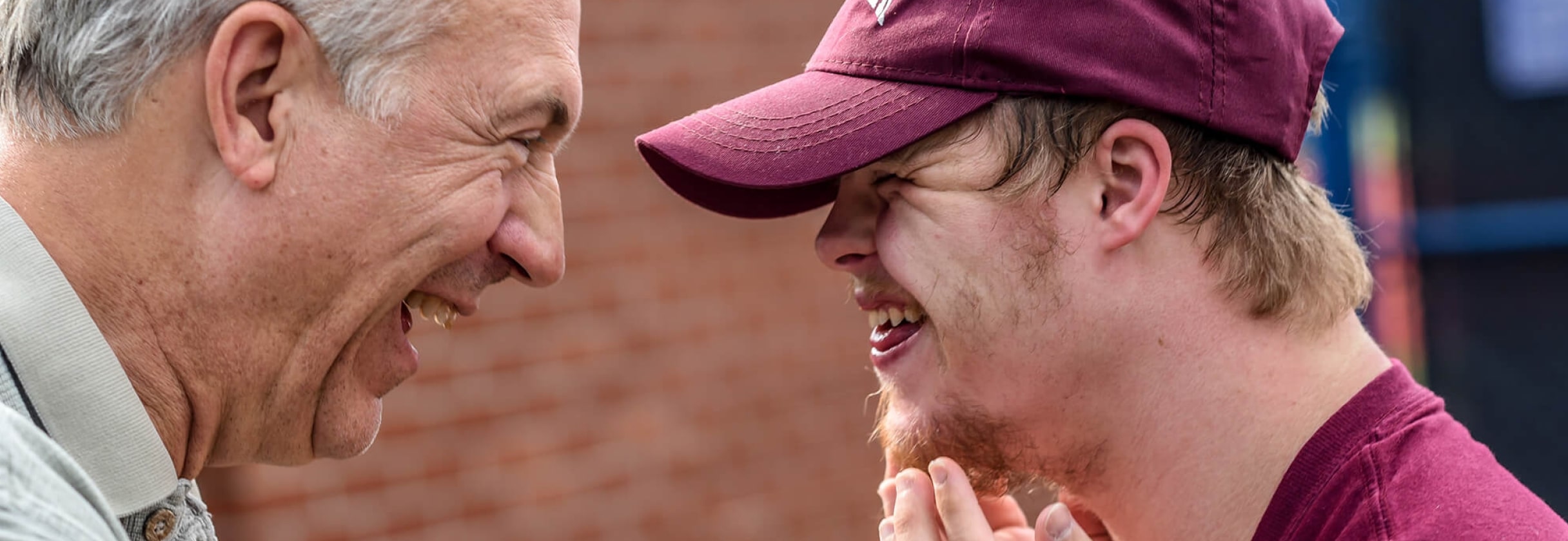 A man with his mouth open and another man with his mouth open.