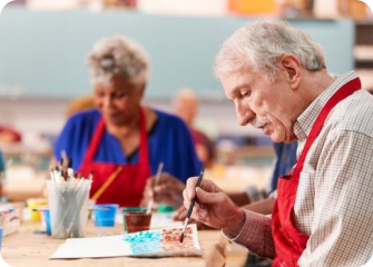 A man and a woman painting.
