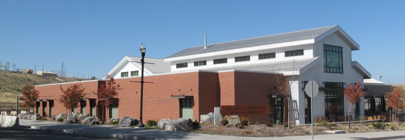 A large building with a parking lot.
