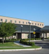 A building with a parking lot.