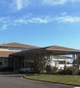 A building with a parking lot.