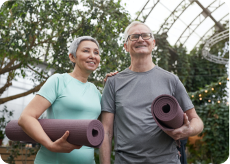 A man and woman holding a skateboard.