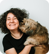 A person holding a dog.