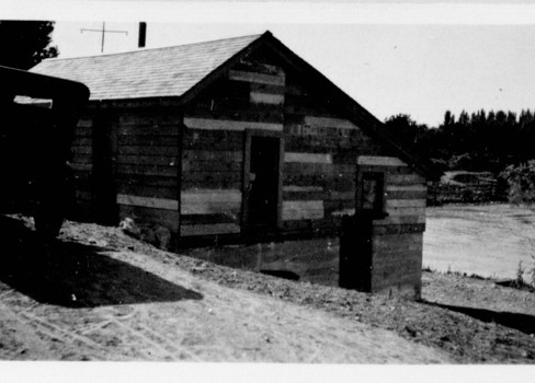 A wooden building with a door.