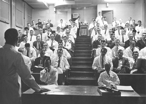 A man addressing a group of people.