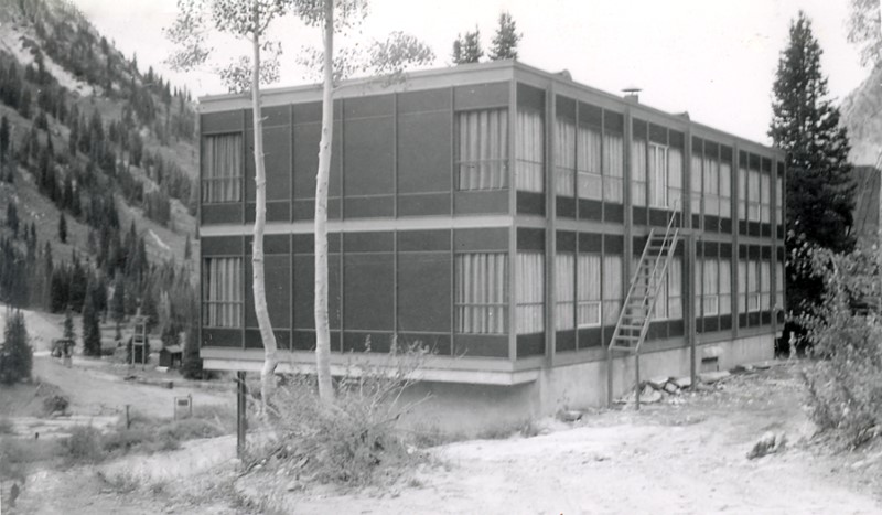 A building with a ladder in front.