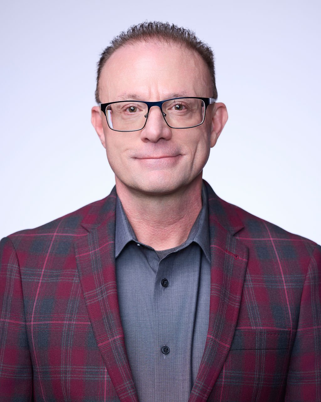 A man wearing glasses.