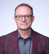 A man wearing glasses.