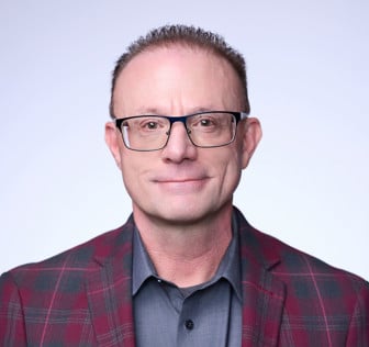 A man wearing glasses.