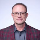 A man wearing glasses.