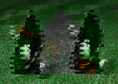 A baseball glove and baseball.