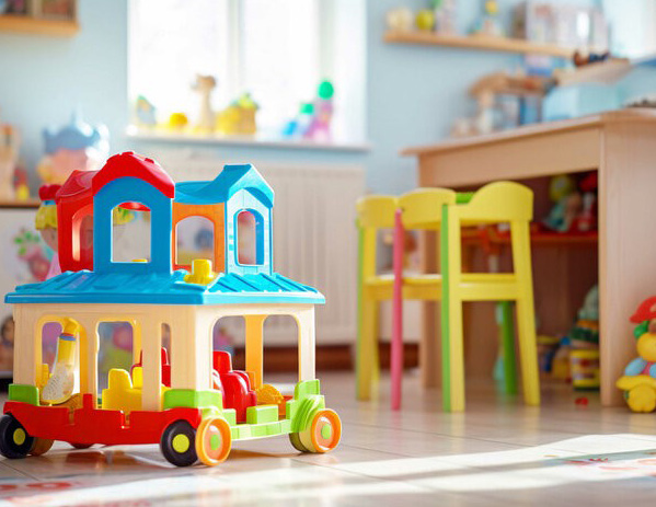 A toy train in a room.