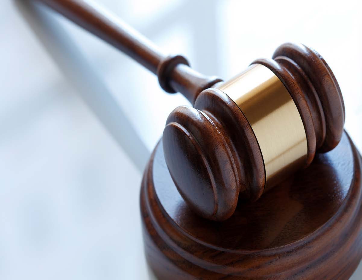 A gavel on a wooden surface.