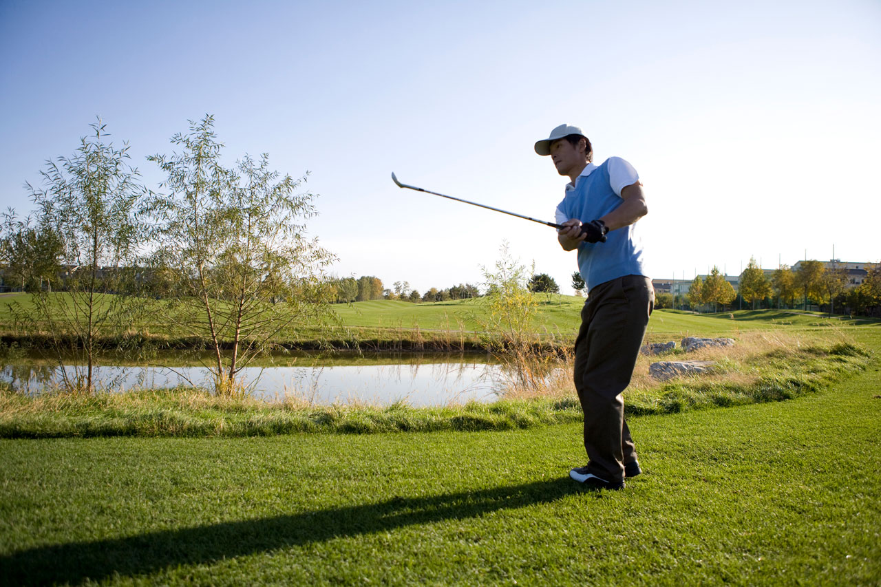 A man playing golf.
