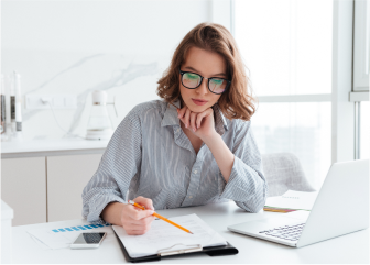 A woman sitting at a desk.