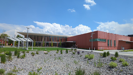 A building with a gravel lot.