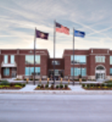 A few flags in front of a building.