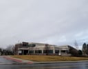 A building with a parking lot.