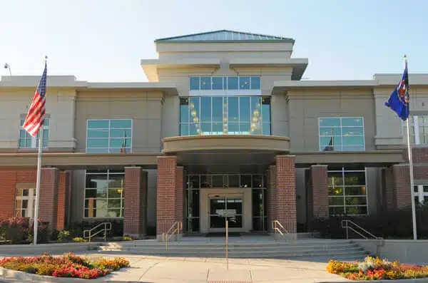 A building with flags in front.