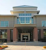 A building with flags in front.