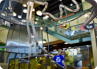 A person standing in a factory.