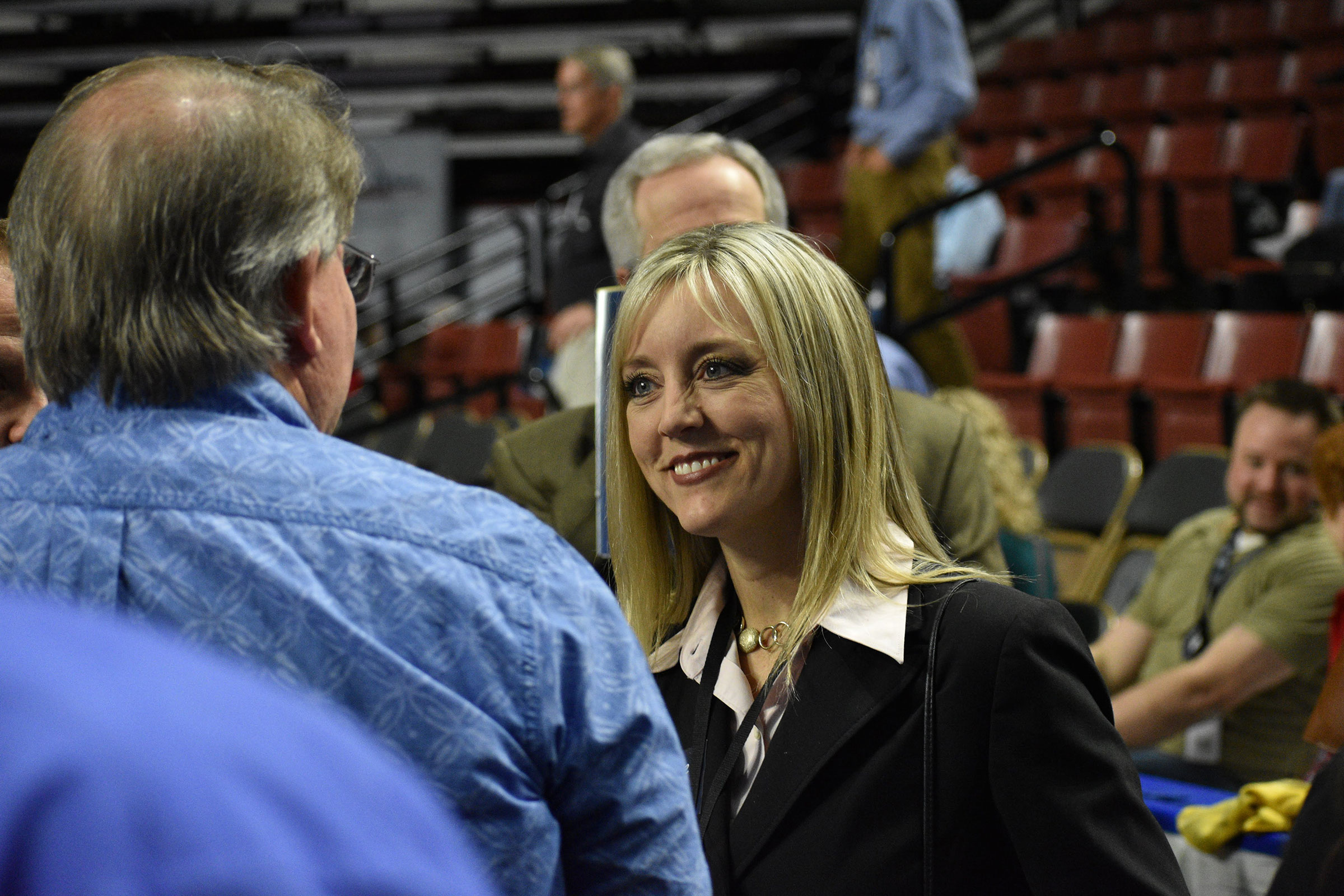 Aimee Winder Newton smiling at a man.