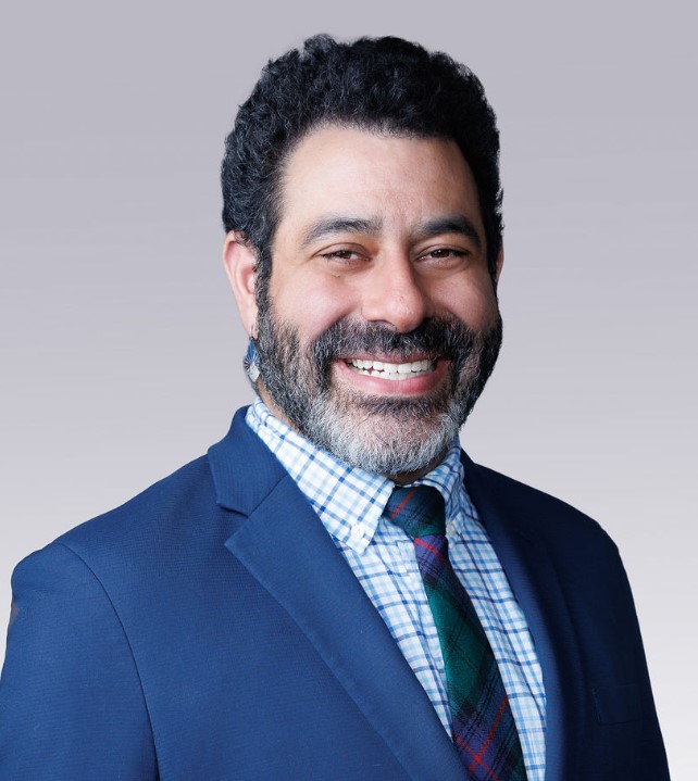 A man smiling for the camera.