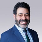 A man smiling for the camera.