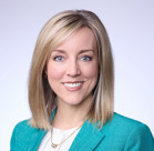 A close-up of Aimee Winder Newton smiling.