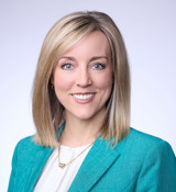 A close-up of Aimee Winder Newton smiling.