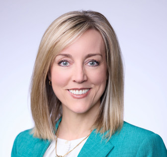 A close-up of Aimee Winder Newton smiling.